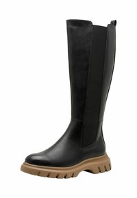 Bottes en cuir noir hauteur genou avec panneaux latéraux en élastique et semelle épaisse marron clair. Texture lisse, bout arrondi et design minimaliste.