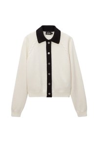 Cardigan tricoté crème avec un col noir et une patte de boutonnage ornée de boutons argentés. Détails texturés sur les épaules et ourlet côtelé.