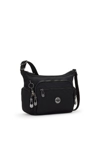 Sort crossbody taske lavet af nylon, med flere lynlåslommer, et rundt logo og sølvfarvede metalaccenter. Justerbar rem medfølger.