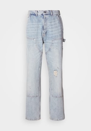 Light blue denim carpenter jeans with multiple pockets, a front button, zipper closure, and distressed detail on the right thigh.