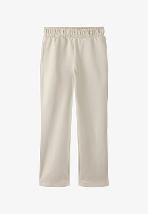 Pantalon de survêtement beige avec une taille élastique, deux poches latérales, coupe droite et texture douce, adapté pour une tenue décontractée.