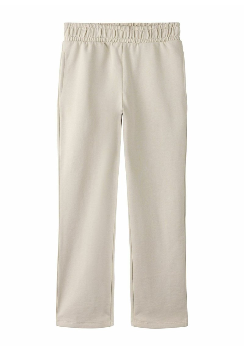 Beżowe spodnie dresowe z elastycznym pasem, dwoma bocznymi kieszeniami, prostym krojem nogawek i miękką fakturą, odpowiednie do noszenia na co dzień.