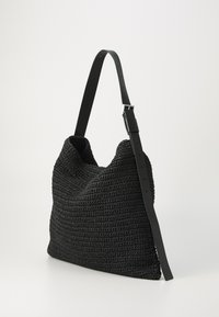 Black woven bag with a slouchy design, featuring a smooth leather strap and adjustable buckle. Texture is intricate with a soft finish.