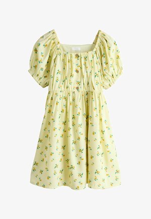 Žuta cvjetna haljina s kratkim puf rukavima, kvadratnim izrezom i detaljem gumbića sprijeda; ukrašena malim žutim cvjetovima i zelenim listovima.