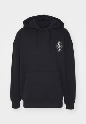 Sweat à capuche noir à enfiler avec poche frontale, cordons ajustables et petit motif blanc géométrique et floral sur la poitrine gauche.