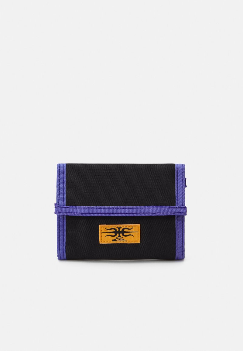 Black fabric wallet with purple trim, featuring an orange logo patch. Design includes a fold-over flap and a compact rectangular shape.