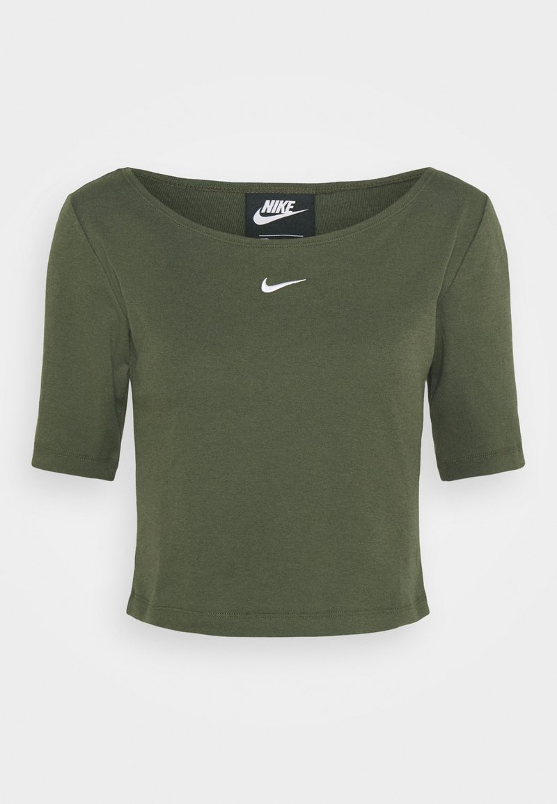 Crop top vert olive à manches courtes en coton, avec un col rond et un petit logo Nike blanc sur la poitrine.