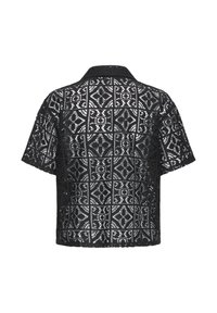 Chemise noire à manches courtes avec motif de dentelle géométrique découpée et col pointu, vue de dos sur fond blanc.