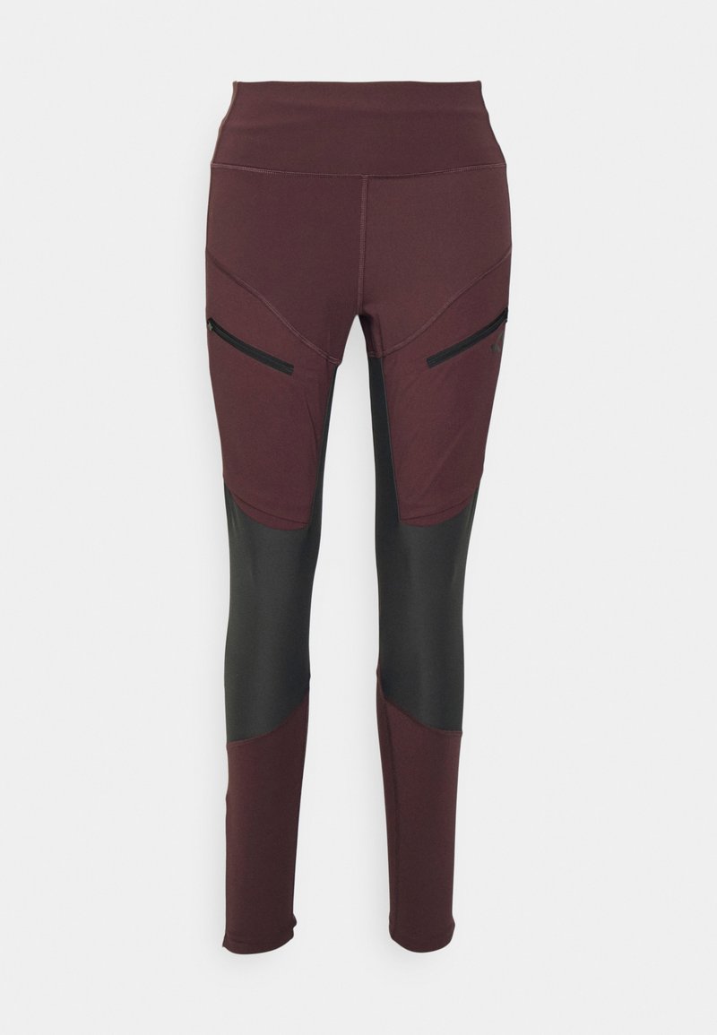 Langbeinige Leggings in dunklem Burgunderrot mit schwarzen Knienähteilen und mit Reißverschluss versehenen Seitentaschen, geeignet für sportliche oder outdoor Nutzung.