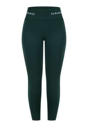 Dunkelgrüne Leggings mit einem hohen Bund und weißem "SMIM"-Schriftzug. Hergestellt aus dehnbarem, glattem Material, figurbetont entlang der Beine.
