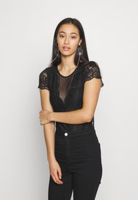 Morgan DONAO - Camiseta estampada - noir