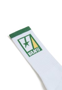 Calze bianche a crew con polsino verde; presenta un logo Vans verde e giallo con una stella in un quadrato. Materiale in cotone lavorato a maglia testurizzata.