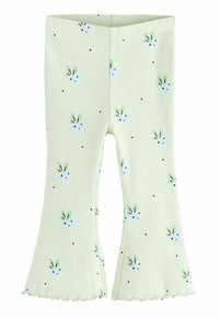Leggings vert côtes avec un bas évasé, présentant un motif floral de fleurs bleues et de feuilles vertes, ainsi que de petits pois noirs.