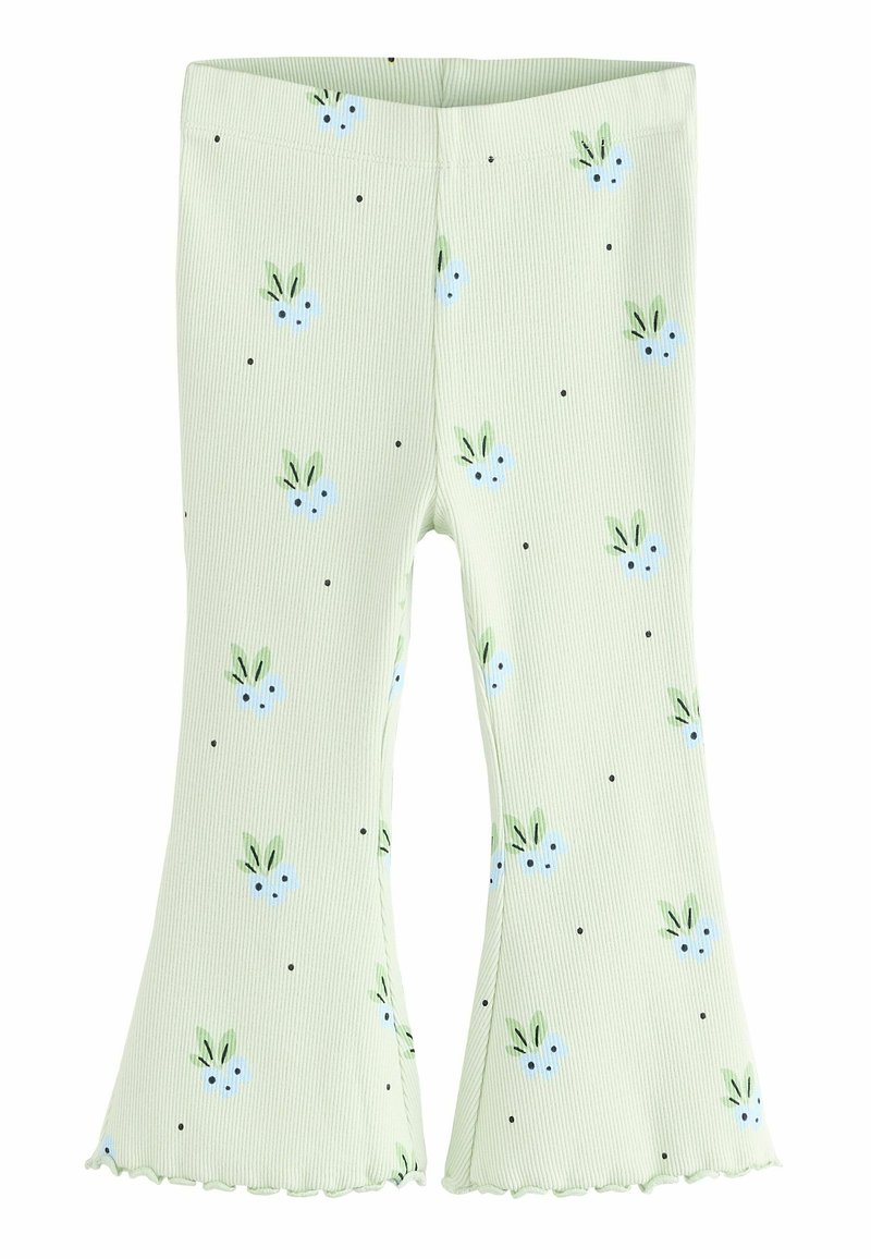 Leggings vert côtes avec un bas évasé, présentant un motif floral de fleurs bleues et de feuilles vertes, ainsi que de petits pois noirs.