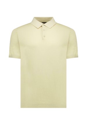 Beige polo met korte mouwen, drie knopen en een klassieke kraag, afgebeeld op een witte achtergrond.