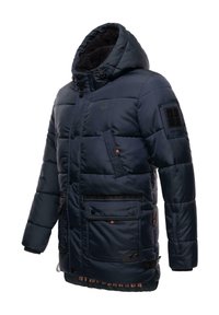 Marineblå pufferjacka med huva, med quiltad textur, flera fickor, svart accenterande lappar och justerbara ärmmuddar.