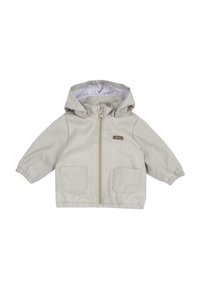 Beige capuchonjack met een ritssluiting aan de voorkant, twee grote opgestikte zakken en elastische manchetten. Aan de binnenkant is het jack voorzien van een gestreepte voering.