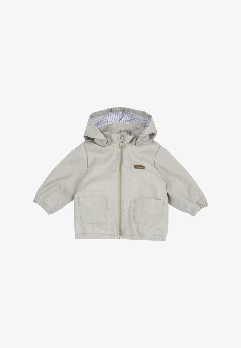 Beige capuchonjack met een ritssluiting aan de voorkant, twee grote opgestikte zakken en elastische manchetten. Aan de binnenkant is het jack voorzien van een gestreepte voering.