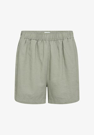 Shorts légers de couleur vert clair, dotés d'une taille élastique, avec une coupe décontractée et un minimum de détails de couture. Fabriqués en tissu respirant.