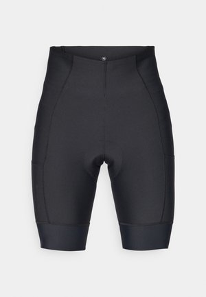 Calças de ciclismo pretas feitas de tecido elástico. Possui uma área de assento almofadada, design sem costuras e forma ajustada com punhos elásticos na barra.