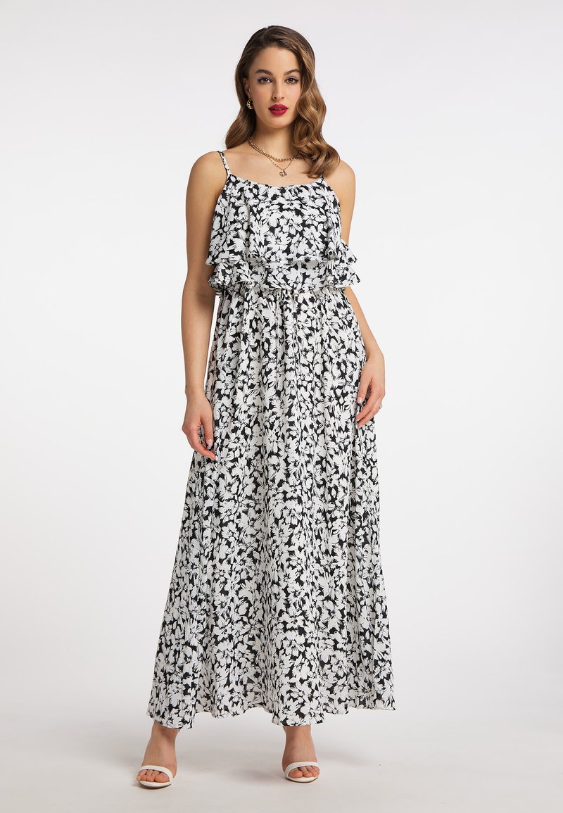 Maxi-jurk in zwart-wit bloemenprint, met rimpelbandjes, een geplooide taille en vloeiende stof. Aangevuld met een strikceintuur.