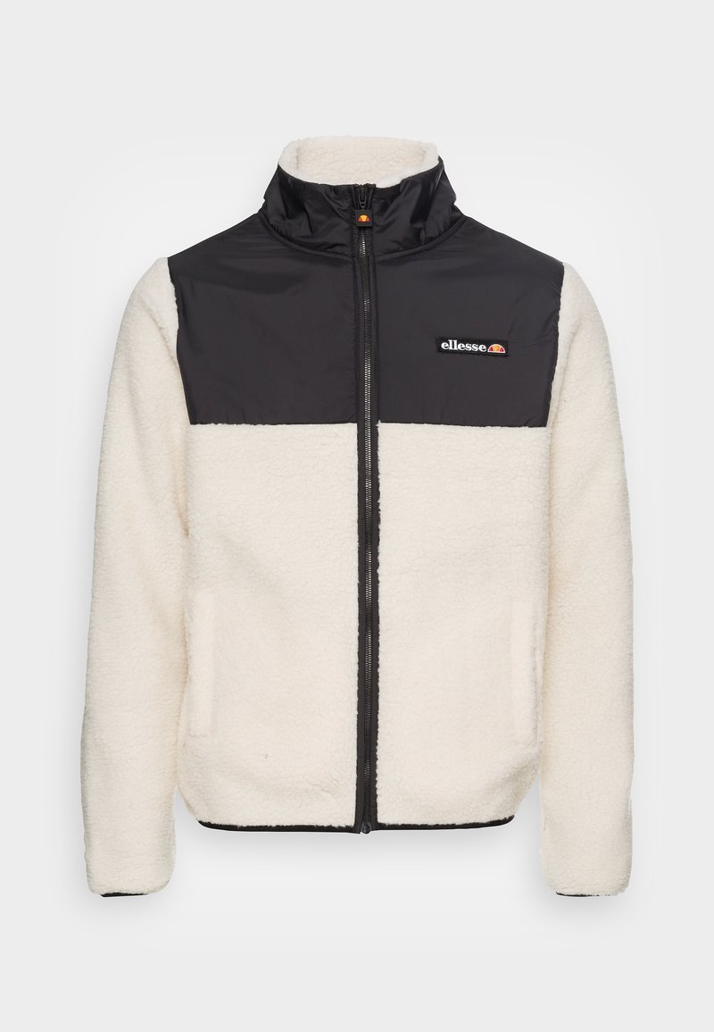 Veste polaire zippée intégralement avec empiècement supérieur poitrine et col en nylon noir, tissu duveteux couleur crème sur le corps et les manches, logo ellesse sur la poitrine.