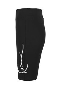 Jupe noire mi-longue à taille haute avec un motif linéaire abstrait blanc minimaliste sur le côté.