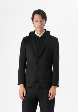 Black blazer with a hoodie attachment, featuring a smooth texture, two front pockets, and a two-button closure. Plain design, no patterns.