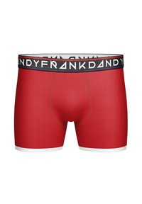 Röda kalsonger i mjukt tyg, med ett svart midjeband som har vit varumärkestext och vita accenter vid fållen.