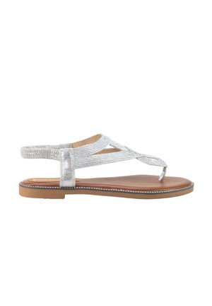 Sandalia plana marrón con tiras de tela plateada y lazo para el dedo, diseñada para uso casual.