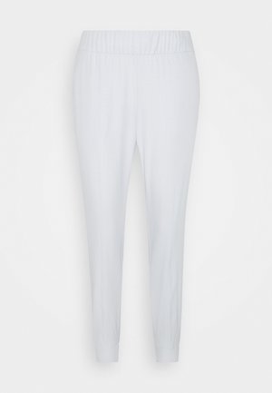 Lichtgrijze joggers met elastische taille en taps toelopende pijpen. Glad textiel, zonder zichtbare patronen of accenten. Boorden bij de enkels.