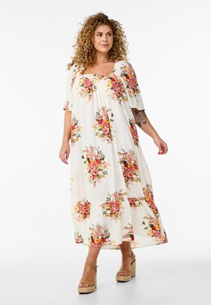 Floral maxi dress in lightweight fabric; features short sleeves and a square neckline. Colors include white, pink, and green with floral patterns.