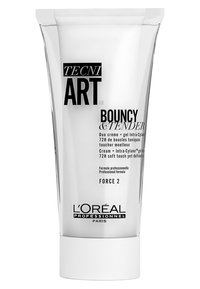 L’Oréal Professionnel Tecni Art Bouncy & Tender crème in een doorzichtige knijpfles met witte dop; heeft vetgedrukte zwarte tekst die de professionele formule benadrukt.