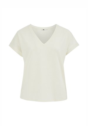 Blusa color crema de manga corta con escote en V, corte holgado y mangas remangadas mostrada sobre fondo blanco.