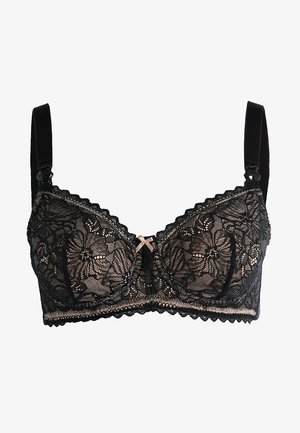 Zwarte kanten beha met een bloemenpatroon, zachte beugel, verstelbare bandjes en een decoratieve roze strik in het midden. Gelaagd kanten band.