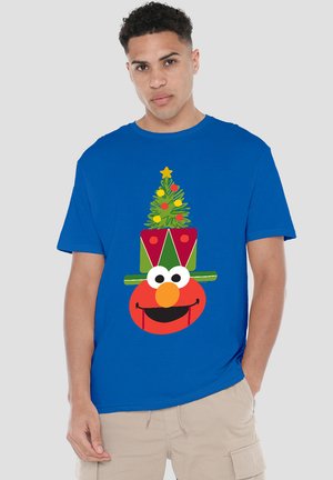 Royal blue cotton t-shirt featuring a large graphic of a smiling Elmo in a festive green and red hat with a Christmas tree and star.