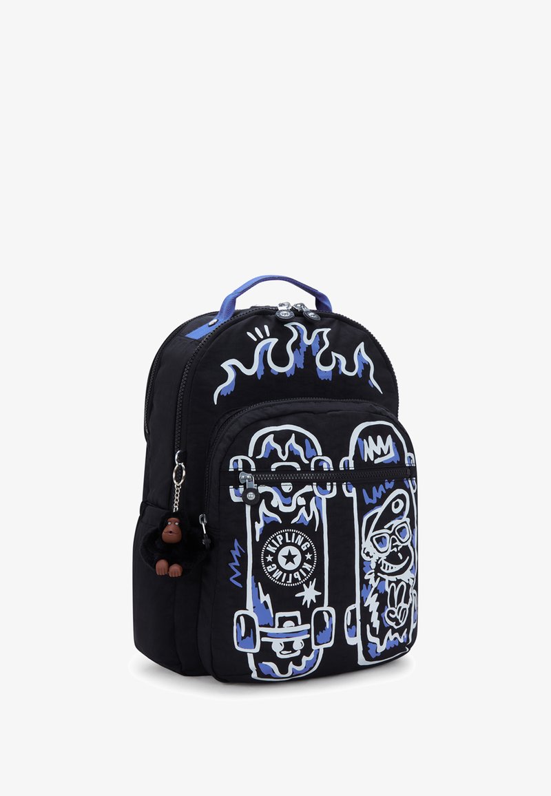 Black backpack featuring blue flame designs and white skateboard graphics. Includes a plush monkey keychain and zipper closures.