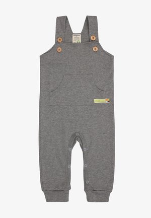 Salopette in cotone grigia con bottoni in legno, tasca frontale e chiusure a scatto nella parte inferiore. Presenta un piccolo etichetta verde sul lato.