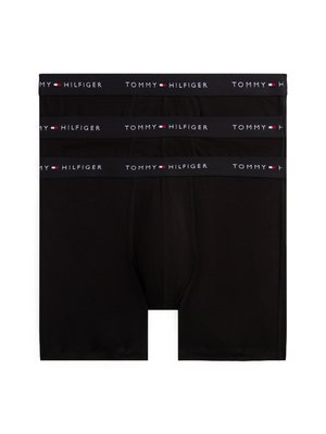 Melni kokvilnas bokseri ar platu elastīgu jostu, kurai ir "TOMMY HILFIGER" logo baltā un sarkanā krāsā. Trīs pāri sakrauti.