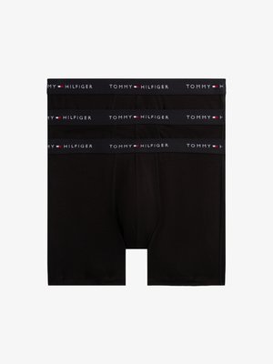 Black cotton boxer briefs with a wide elastic waistband featuring "TOMMY HILFIGER" logo in white and red. Three pairs stacked.