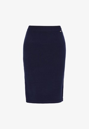 Térd hosszúságú, sötétkék kötött szoknya bordázott derékrésszel, oldalsó hasítékkal és egy kis fémbetéttel a derékrészen. Sima textúra.