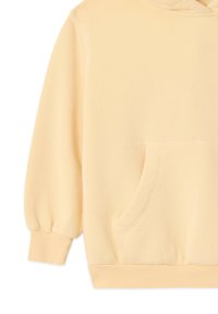 Hoodie beige clair avec manches longues bouffantes, poche kangourou à l'avant, poignets et ourlet côtelés, fabriqué en tissu doux.