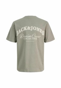 Helehall lühikeste varrukatega T-särk, mille tagaküljel on valged tekstid "JACK & JONES Denim Crew Collective".