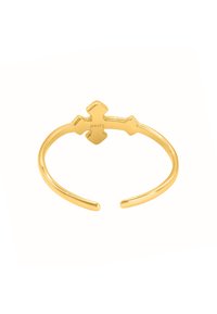 Bracelet jonc en métal doré avec un motif de croix au centre, surface lisse, extrémités ouvertes et logo gravé sur un côté.