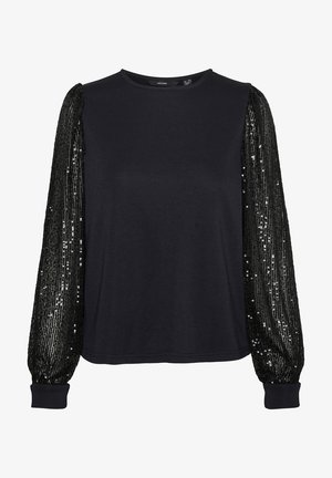 Mustmust pikkade varrukatega särk, millel on ühtlane keha ja sädelevad puffvarrukad. Omab ümmargust kaelust ja ülikitsaid mansette varrukate allosas.