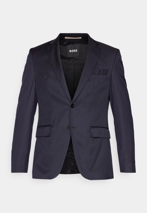 Mornarsko sako od glatkog materijala, s jednim dugmetom, reverima i dva prednja džepa. Obložen unutrašnji deo s diskretnim uzorkom.