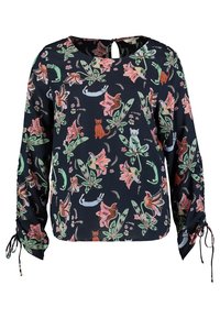 Långärmad blus i mörk marinblått tyg, med ett blommönster och djurmönster i rosa och grönt. Rund halsringning med nyckelhålsdetalj och rynkade manschetter.