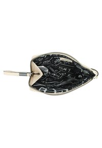 Cream-colored leather pouch with a zip closure, featuring a black interior lined with white handwritten-style graphics and accents.