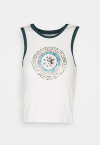 White sleeveless shirt with dark green trim and a central circular design featuring a yin-yang symbol and decorative patterns.