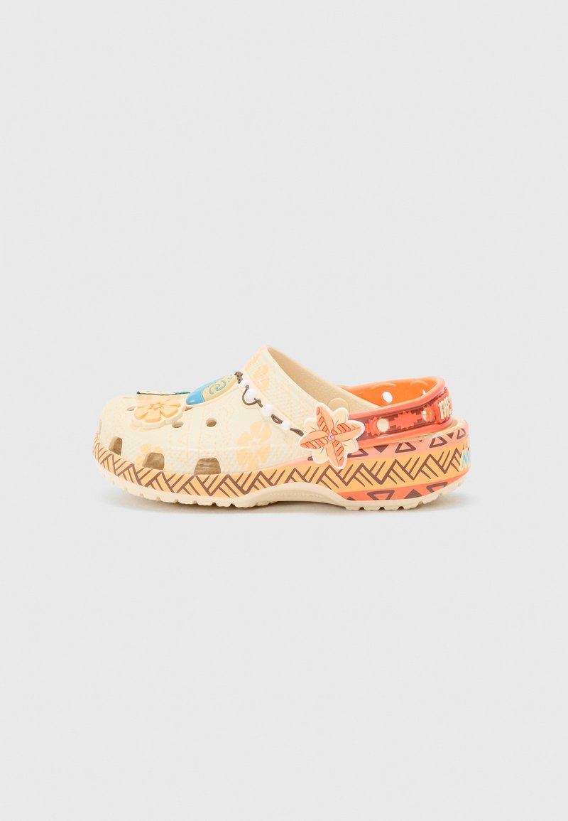 Clogs in cream with floral patterns and colorful hardware accents, featuring ventilation holes and a zigzag design on the sole.